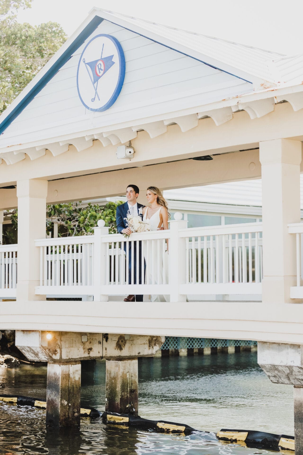 a man and woman standing on a bridge