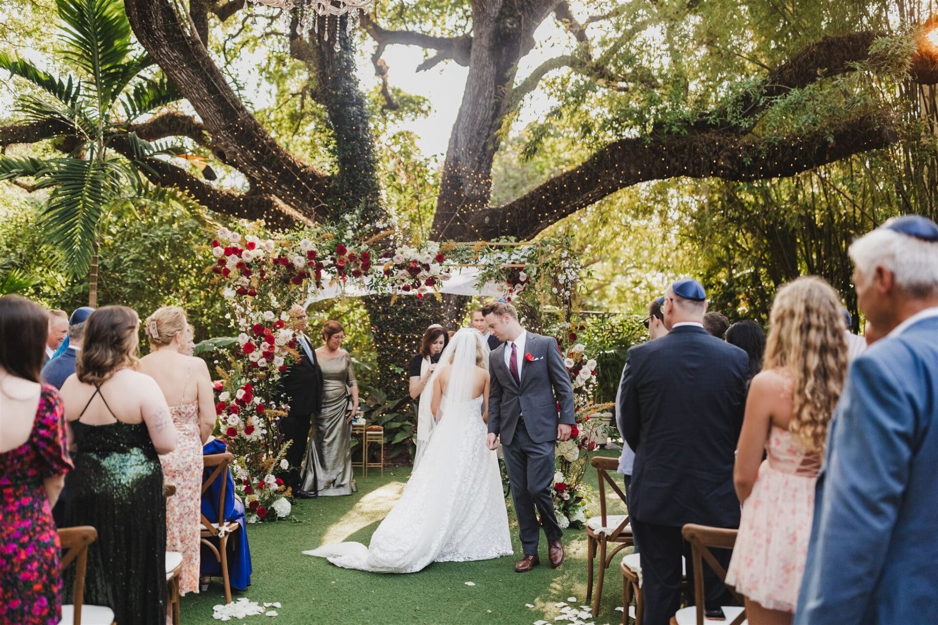 A groom walking around the bride during the circling, a jewish wedding tradition.
